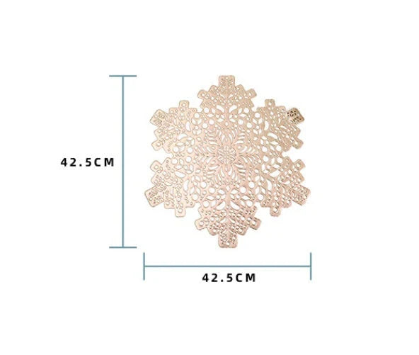 Snowflake-patterned heat-resistant placemats in gold and silver colors, ideal for holiday table settings and decor