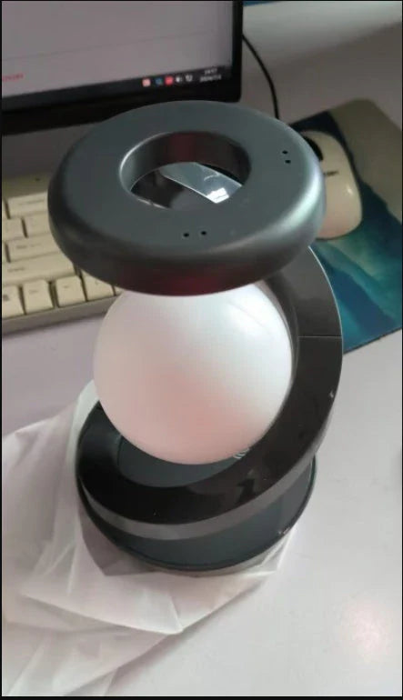 Stylish Rotating Moon Lamp with Wireless Phone Charging - Captivating Desk Accessory with Soothing Lighting and Convenient Wireless Charging