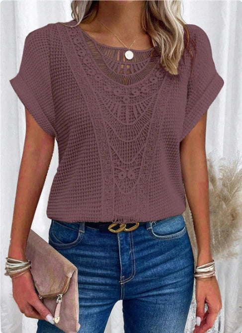 A stylish and comfortable short-sleeve t-shirt for women, featuring a unique hollowed-out design and breathable polyester fabric.
