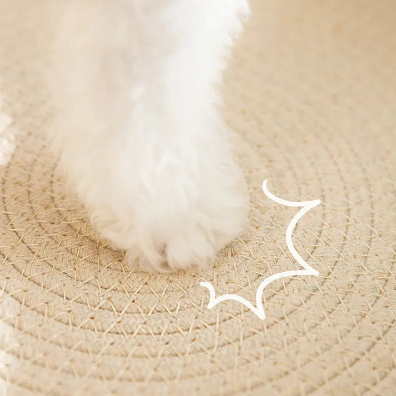 Green oval-shaped sisal cat scratching pad with a deep centre bowl for use as a cat bed.