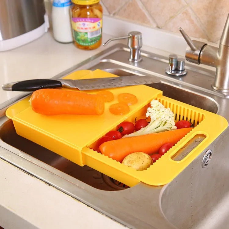 Blue multifunction kitchen chopping board with integrated sink drain basket and TPE handle.
