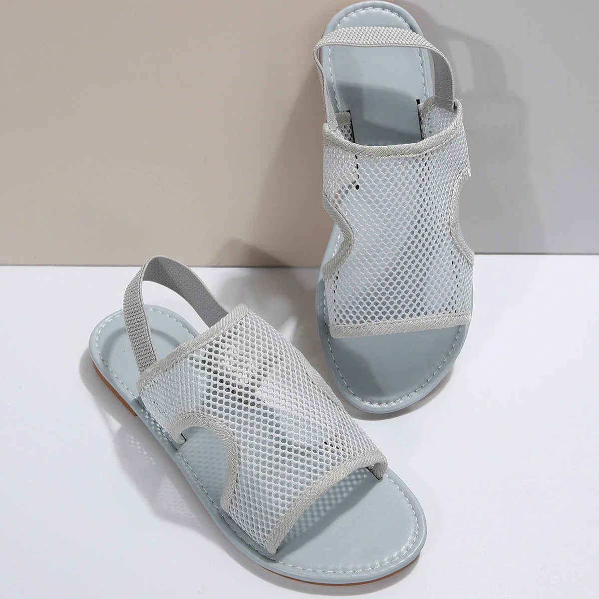 Breathable mesh sandals in various colors and styles for comfortable summer wear