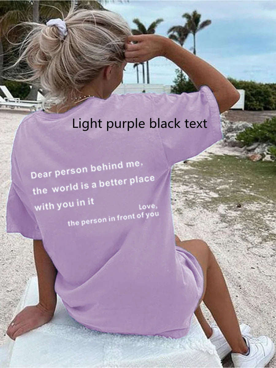 Stylish women's graphic t-shirt with trendy slogan, featuring a vibrant print design and comfortable short sleeve silhouette.