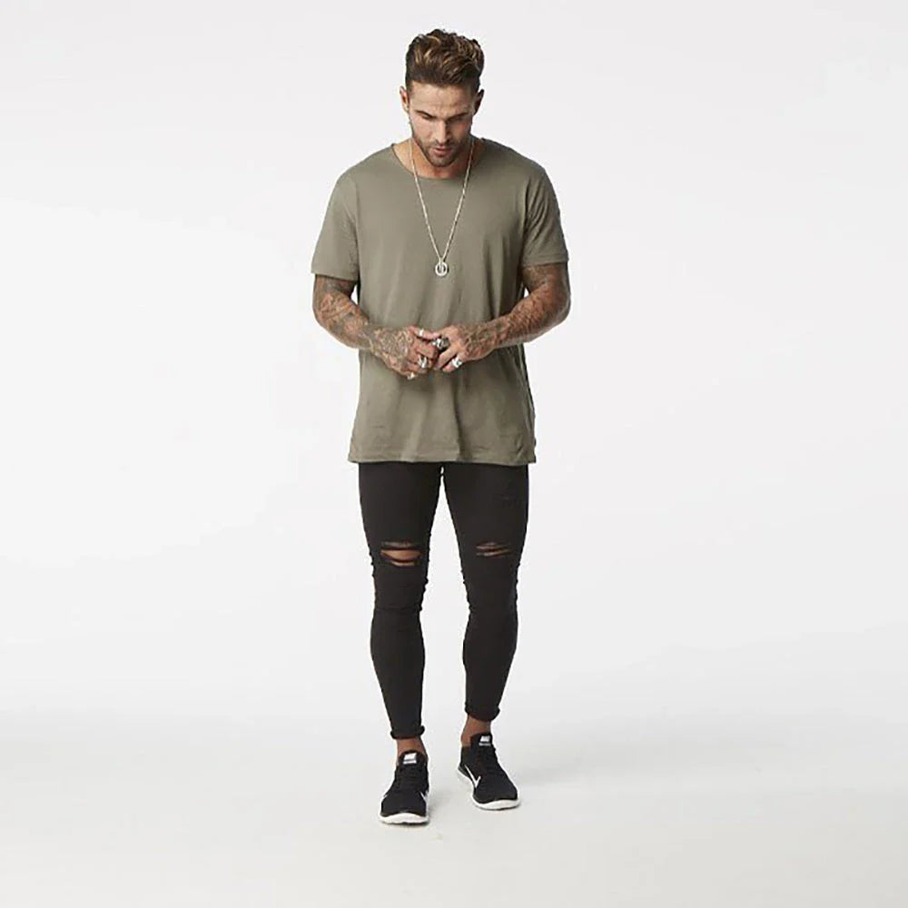Trendy distressed black skinny jeans for men, featuring a super-elastic cotton construction and edgy, lived-in look