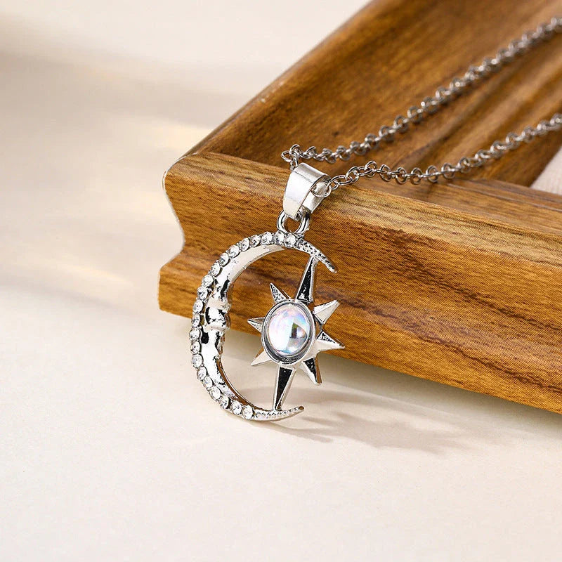 Stylish moon and star zircon pendant necklace with a dazzling celestial design and stainless steel construction