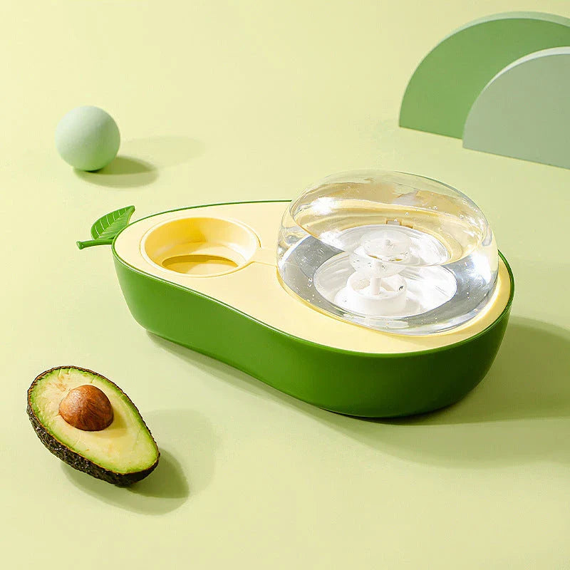 Avocado-shaped automatic pet food and water dispenser for dogs and cats, featuring a raised feeder, slow-feed bowl, and adjustable water flow