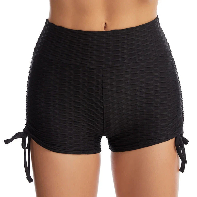Curve-enhancing workout shorts in a variety of vibrant colors with a drawstring waistband for a customized fit.