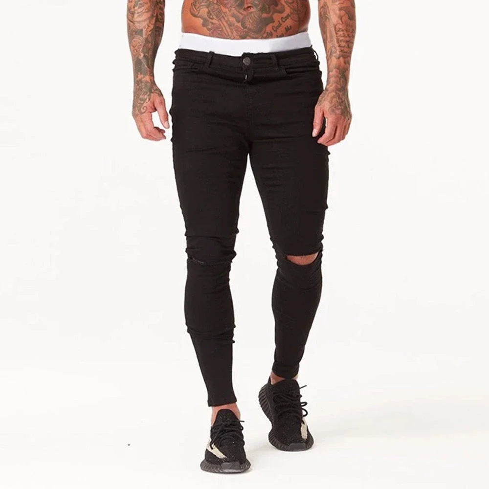Trendy distressed black skinny jeans for men, featuring a super-elastic cotton construction and edgy, lived-in look