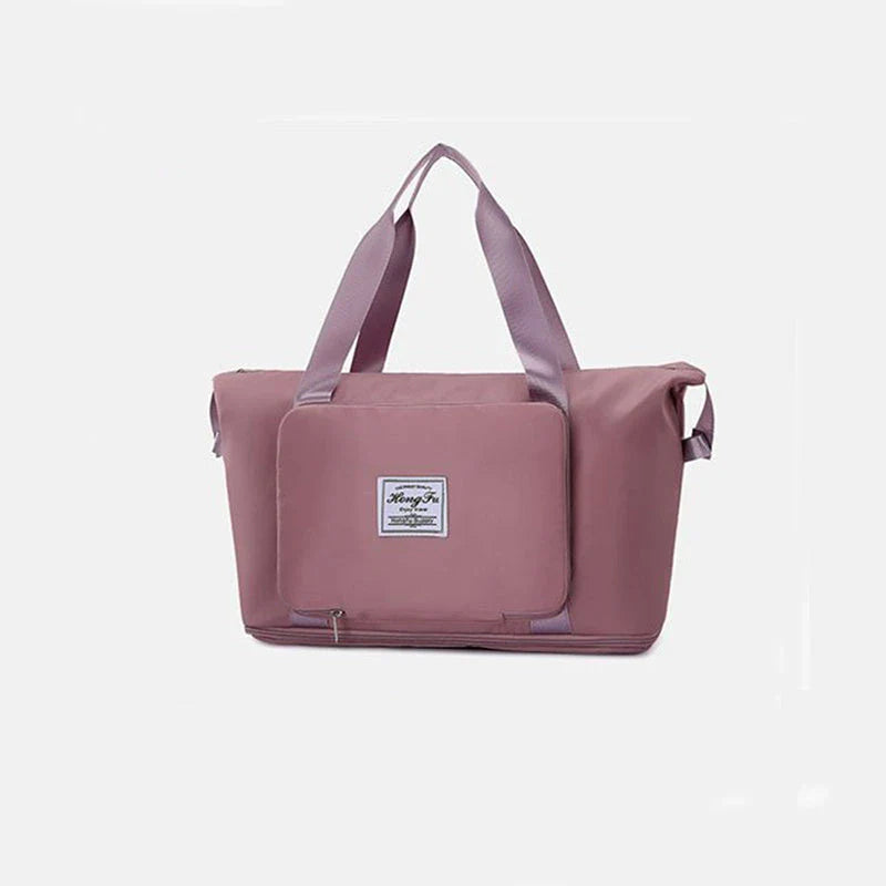 Stylish and spacious foldable travel bag for women, featuring a water-resistant Oxford cloth construction, multiple pockets, and convenient carrying options.