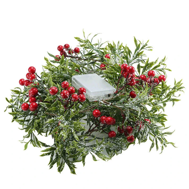 Festive Christmas fairy lights with leaf shapes and crimson berries, creating a warm, enchanting glow