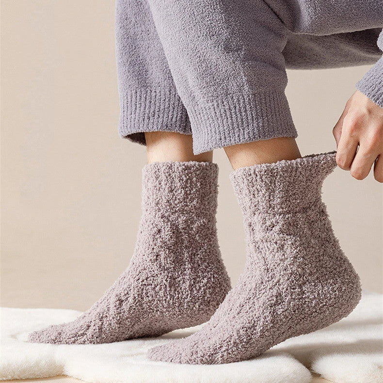 Plush coral fleece socks in various colors, designed for cozy and comfortable home wear
