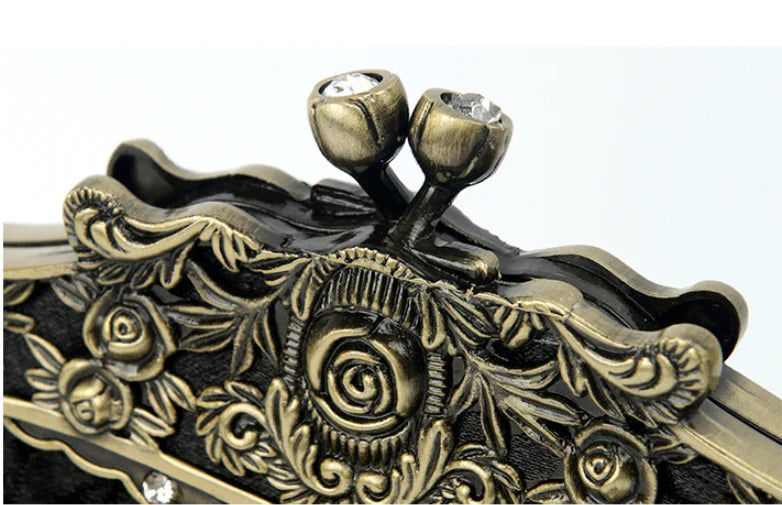 A black cosmetic bag with exquisite bead embroidery, featuring a silk surface and nylon fabric texture for a luxurious feel.