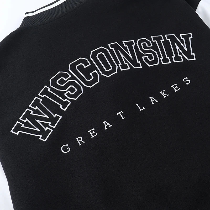 A classic British-style baseball jacket with contrast PU stitching, showcasing a sophisticated and versatile design for casual wear.
