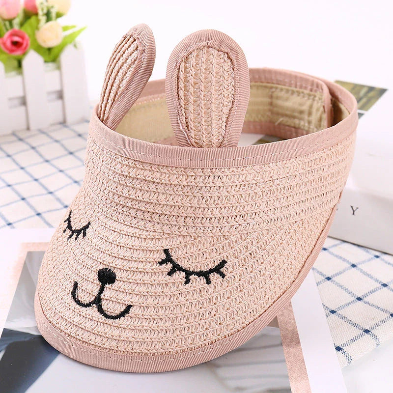 Rabbit-themed straw sun hat for kids with adjustable strap and foldable design for portability