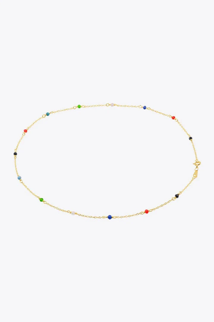 Elegant 18-carat gold-plated necklace with multicoloured beads in a minimalist, contemporary design