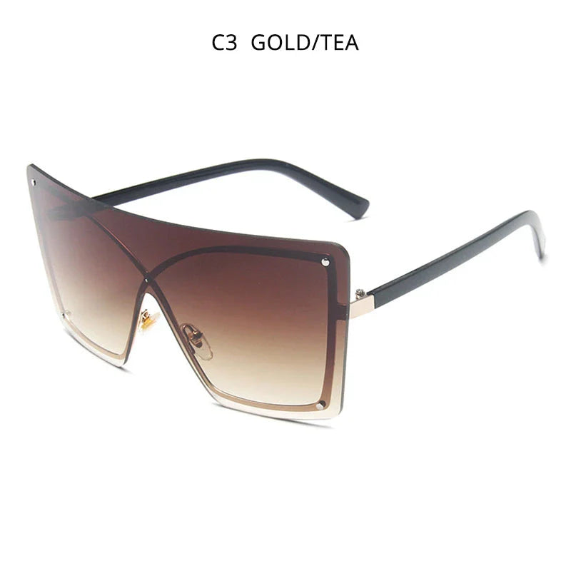 Stylish oversized flat top sunglasses with a rimless design, providing UV protection and a comfortable fit for the modern British woman