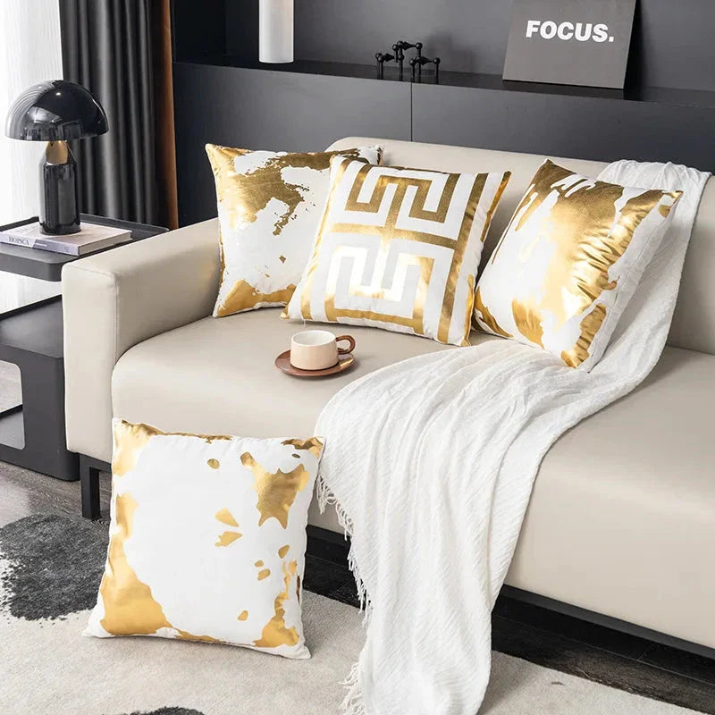 Pair of Nordic-inspired geometric plush pillowcases with a luxurious gold pattern on a white and black background