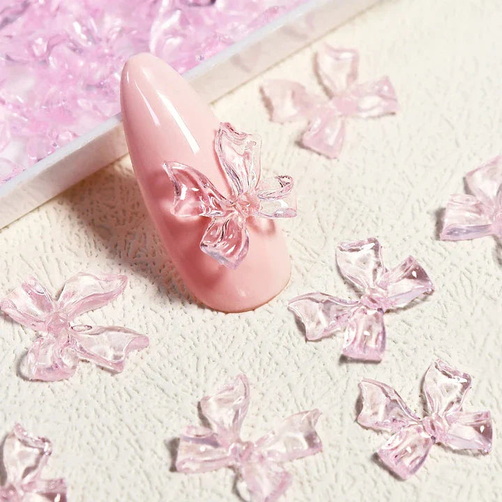 Charming candy-coloured bow nail charms in various colours, perfect for adding a playful touch to your manicure