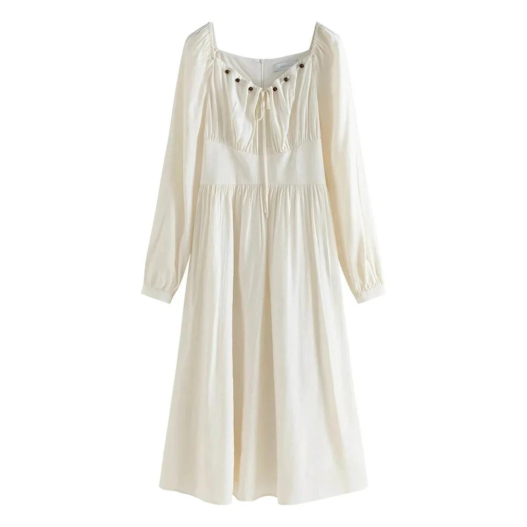 Elegant Chinese-style dress with empire waistline, full-length sleeves, and midi length for a timeless, sophisticated look.