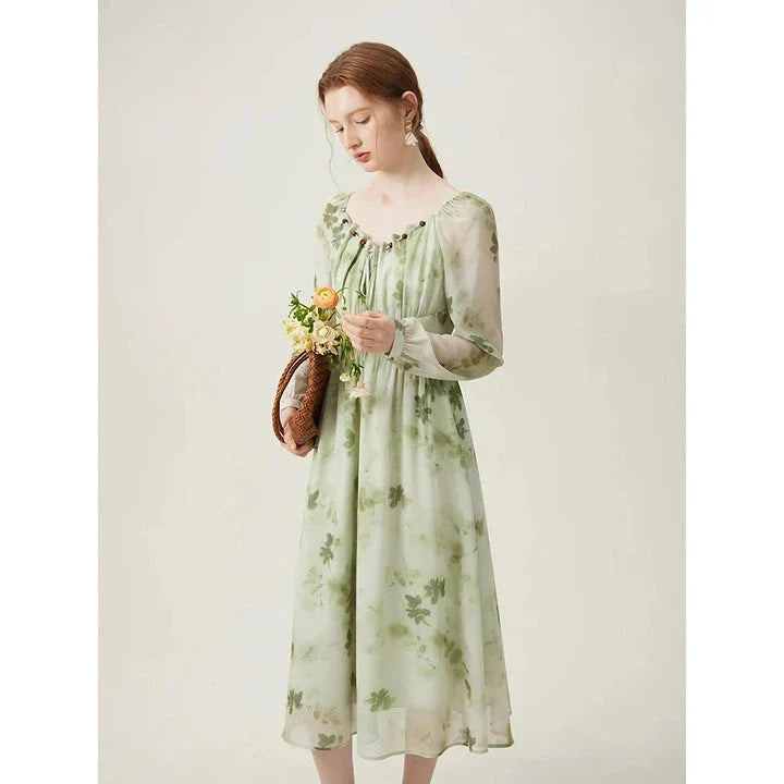 Elegant Chinese-style dress with empire waistline, full-length sleeves, and midi length for a timeless, sophisticated look.