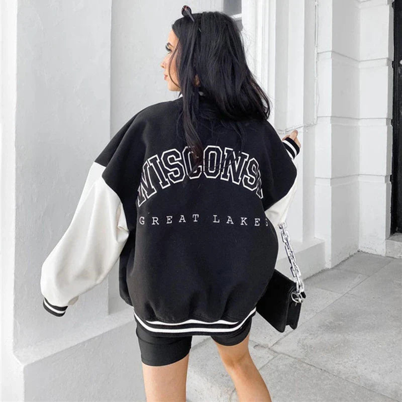 A classic British-style baseball jacket with contrast PU stitching, showcasing a sophisticated and versatile design for casual wear.