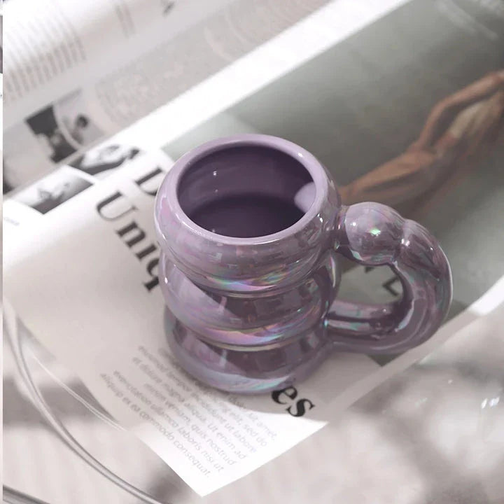 Charming ceramic coffee mug with a circular bubble design in a light blue colour, perfect for morning beverages in the UK