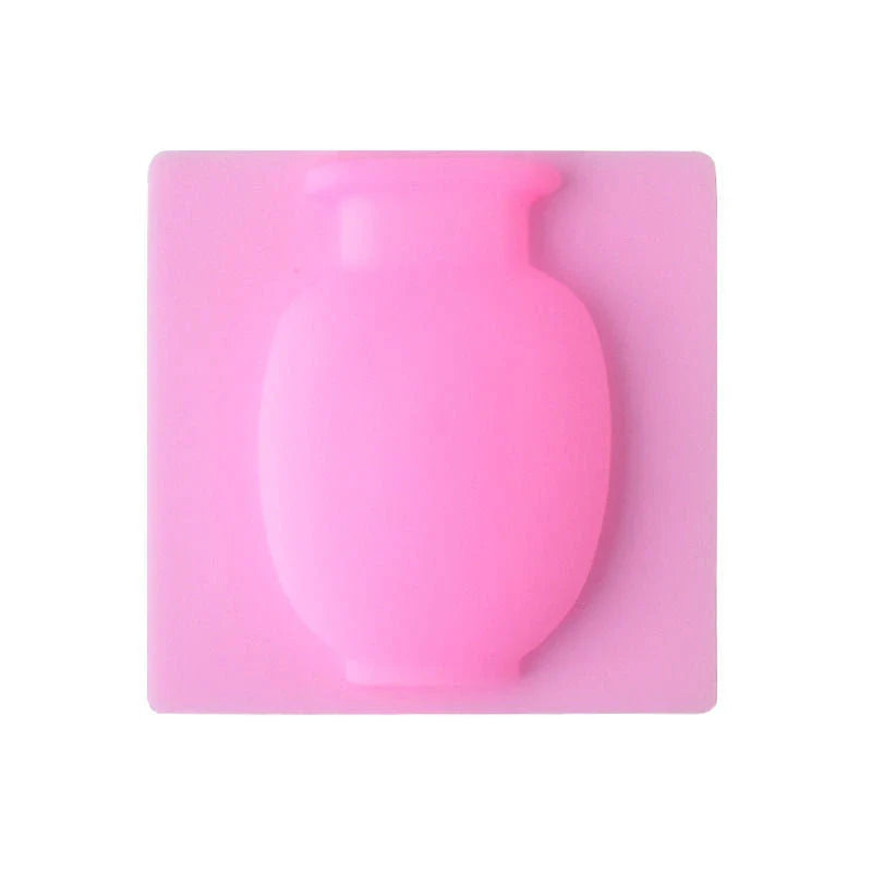 Elegant silicone suction wall vase in pink, designed to hold various plant sizes and fit seamlessly in modern homes