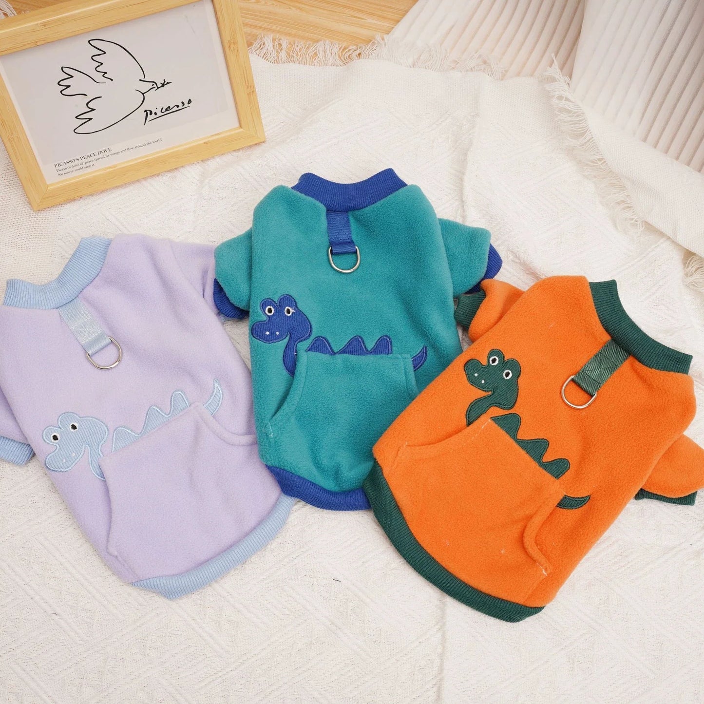Plush and cosy pet clothing in various colours, designed for warmth and comfort