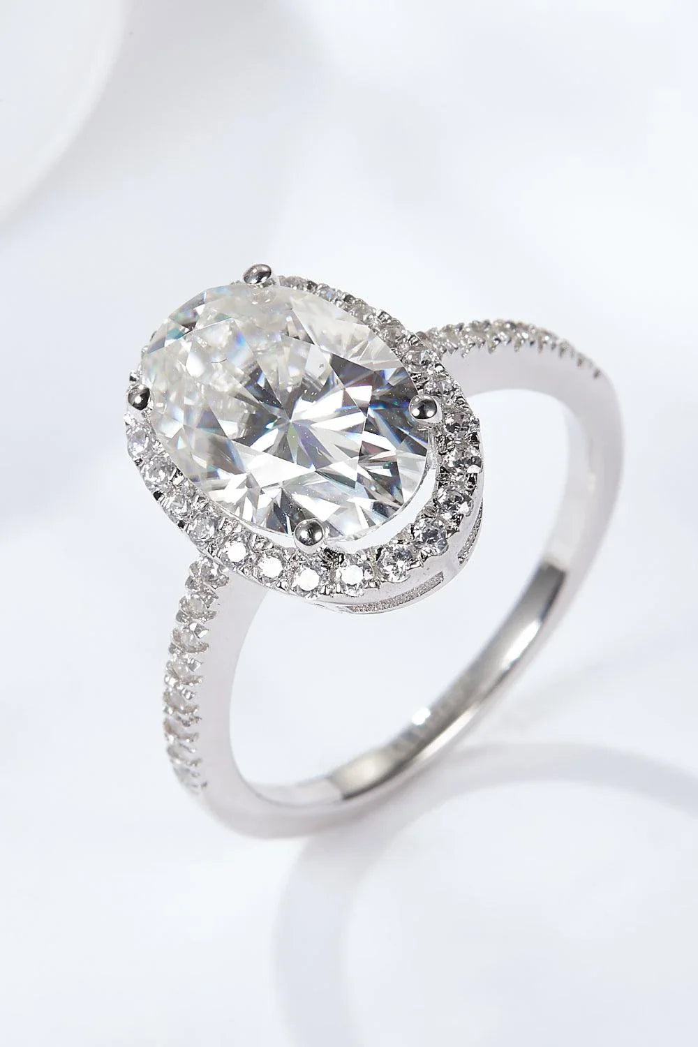 Elegant moissanite halo ring in polished sterling silver with a captivating 4.5-carat centre stone