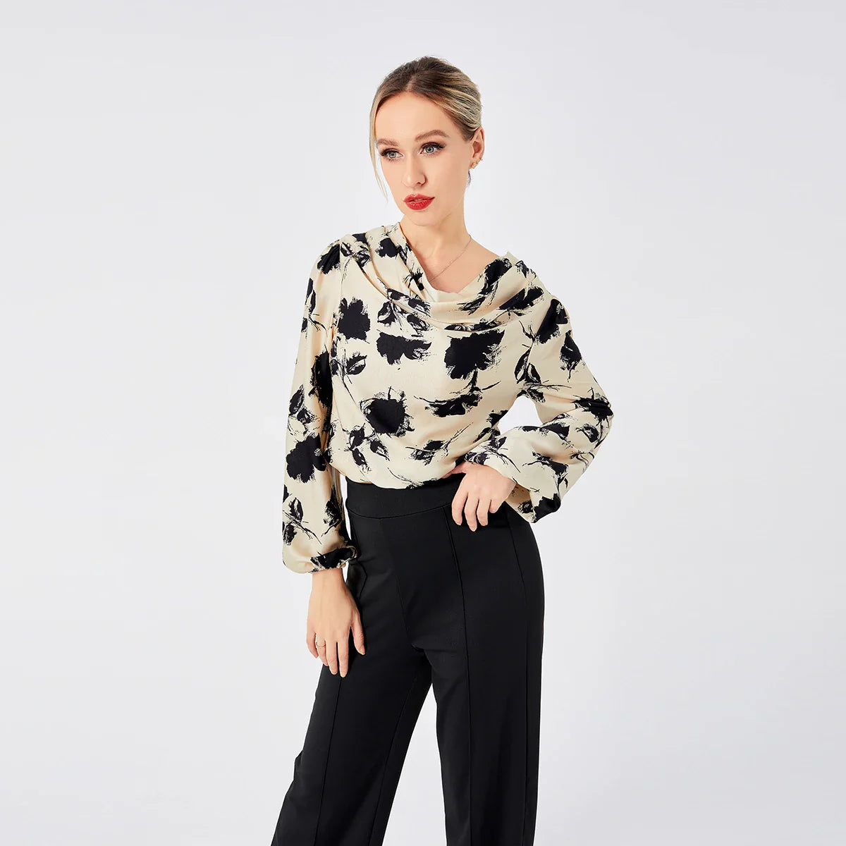 Elegant ladies' blouse with a printed pattern, dropped collar, and long sleeves in a classic white colour