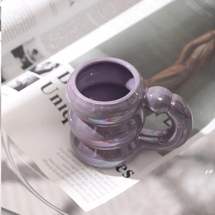 Charming ceramic coffee mug with a circular bubble design in a light blue colour, perfect for morning beverages in the UK