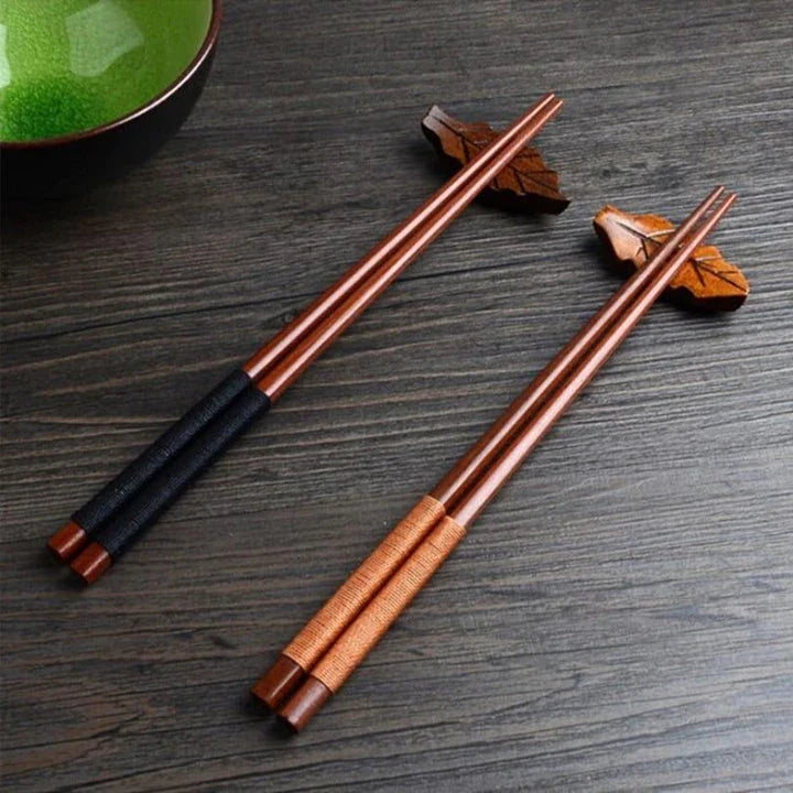 Pair of natural chestnut wood chopsticks with a rustic, earthy tone and elegant design