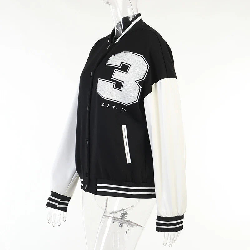A classic British-style baseball jacket with contrast PU stitching, showcasing a sophisticated and versatile design for casual wear.