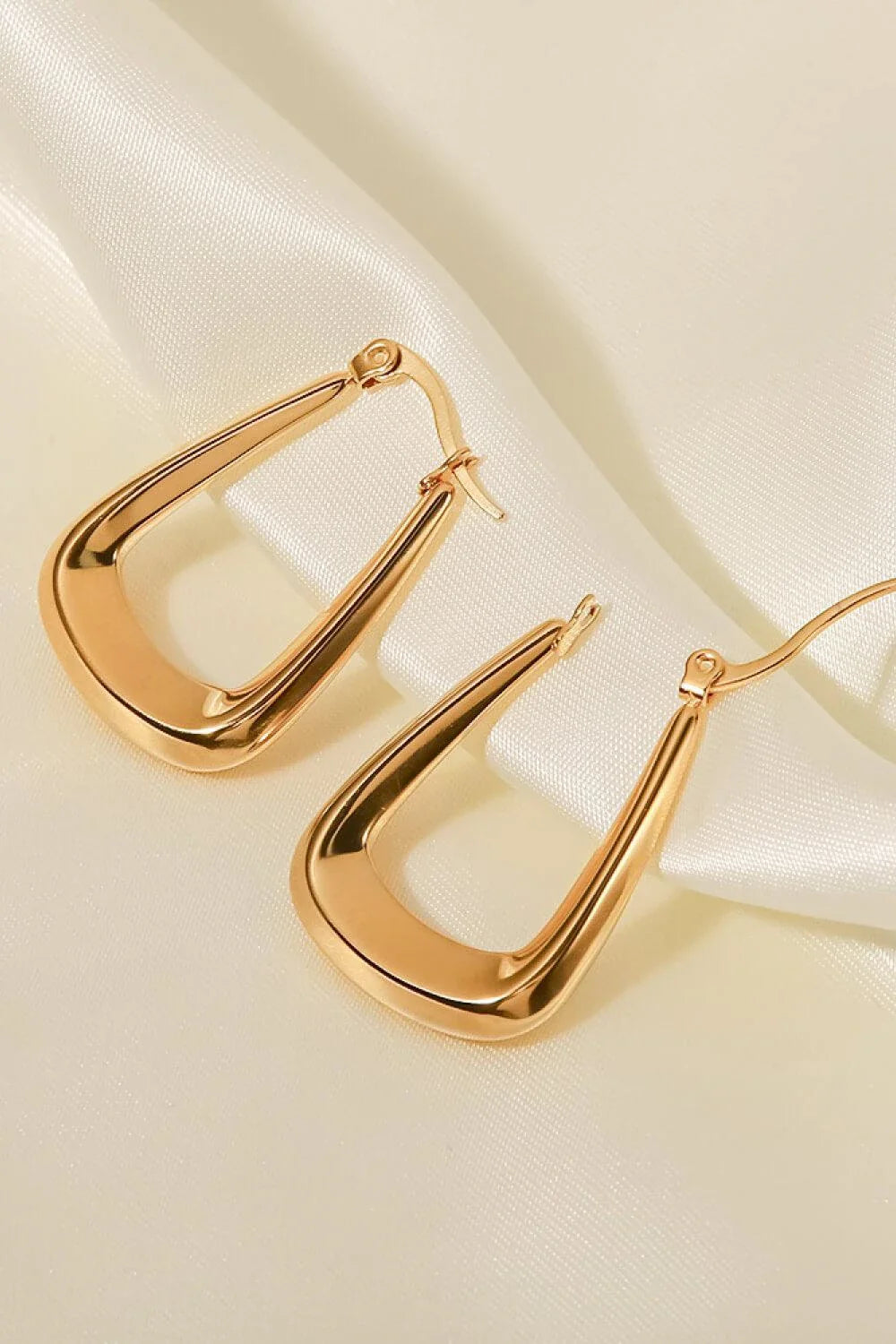 A pair of 18K gold-plated geometric earrings with a sleek and modern design