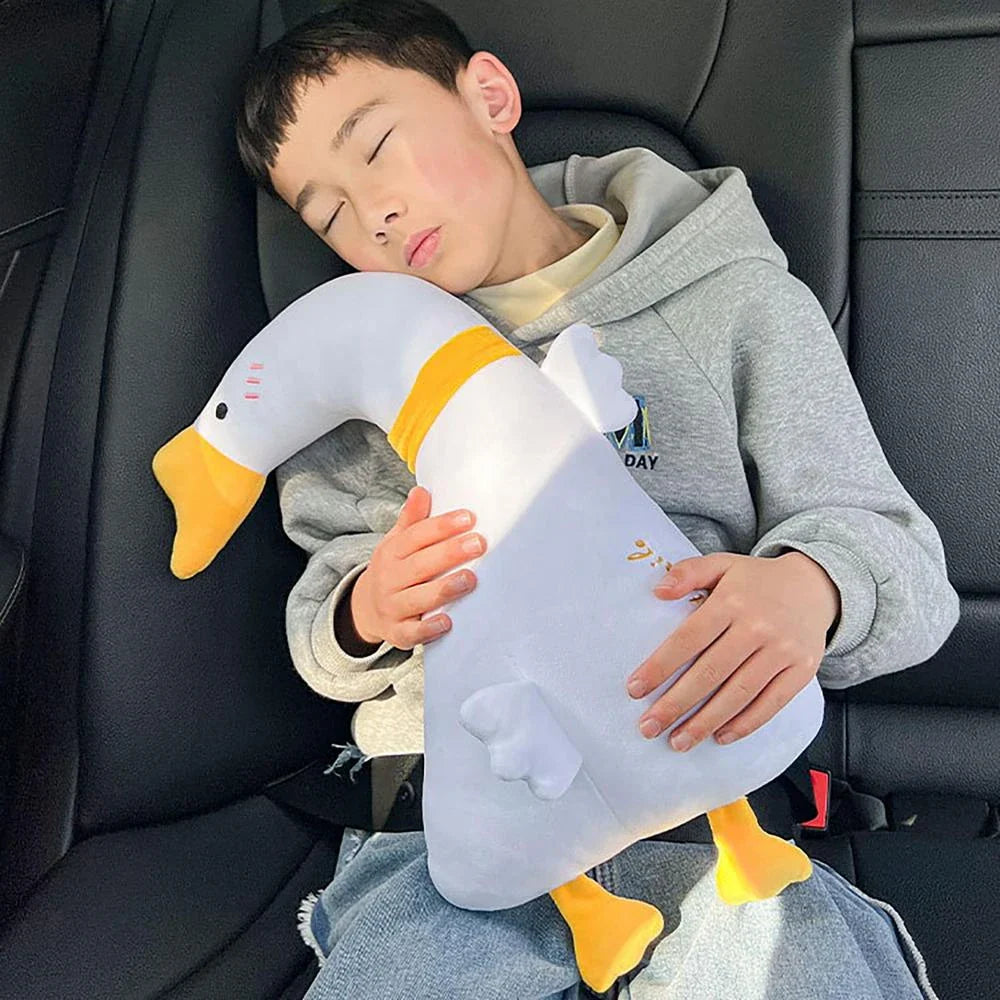 Comfortable car seat belt cushion pads with soft, breathable polyester fabric and plush PP cotton filling in fun cartoon designs including a giant goose, pink dinosaur, long-necked green dragon, and yellow giraffe
