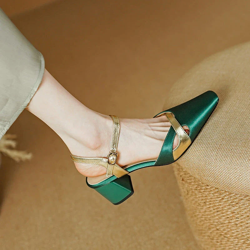 Elegant green high heel sandals with ankle strap, showcasing a sophisticated square heel design and premium materials