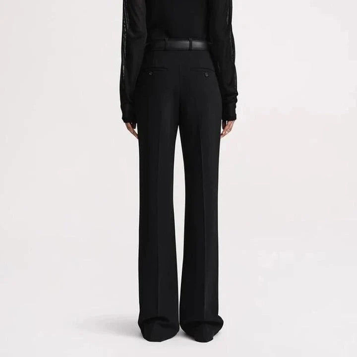 Elegant high-waist flared trousers for women in a solid pattern with a flattering fit and subtle pocket details