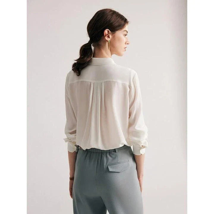 Elegant white mulberry silk office blouse with classic turn-down collar and straight, regular fit for a flattering silhouette