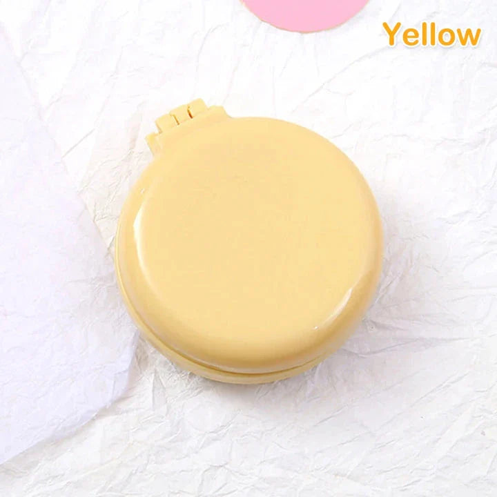 Portable folding hair comb with mirror, featuring a dual-sided design with a round mirror and eco-friendly hairbrush for on-the-go styling and grooming