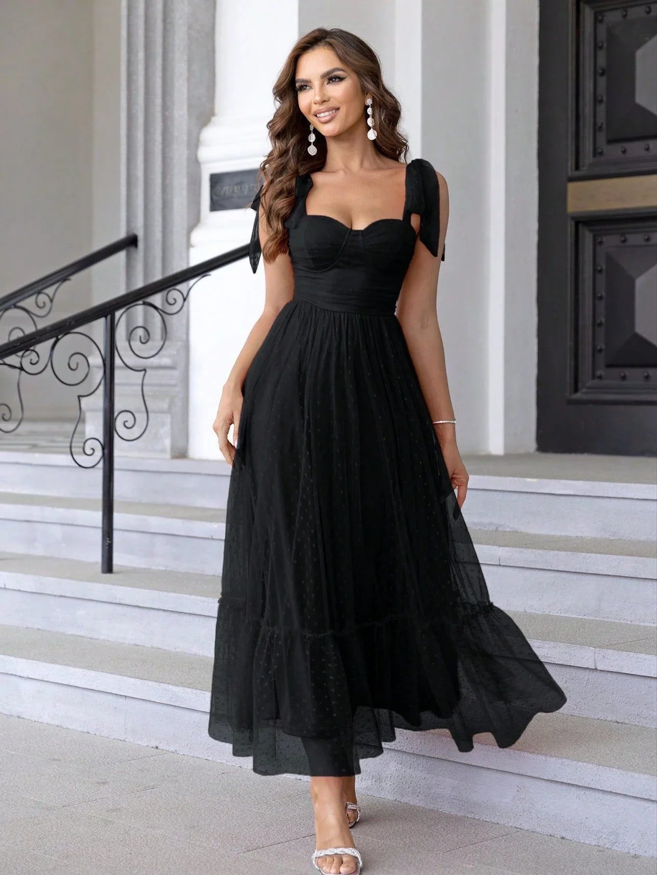Enchanting fairy-style dress with flowing silhouette, delicate lace accents, and mid-length skirt in a classic black colour