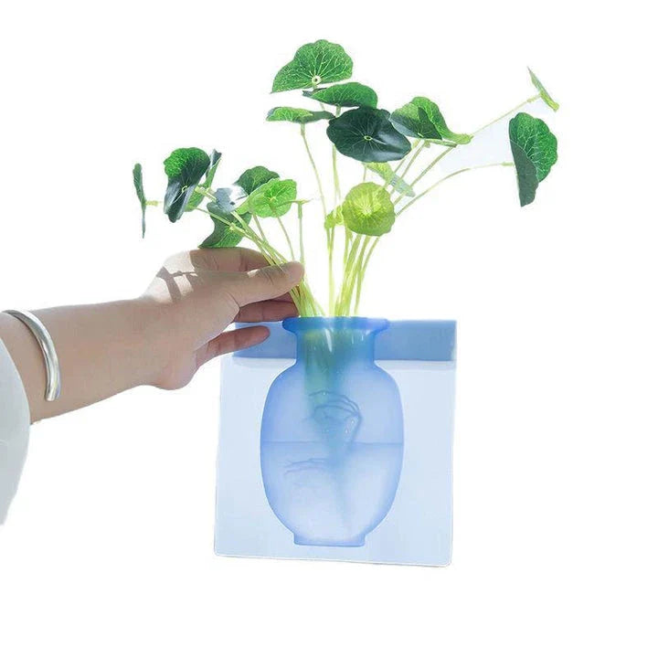 Elegant silicone suction wall vase in pink, designed to hold various plant sizes and fit seamlessly in modern homes