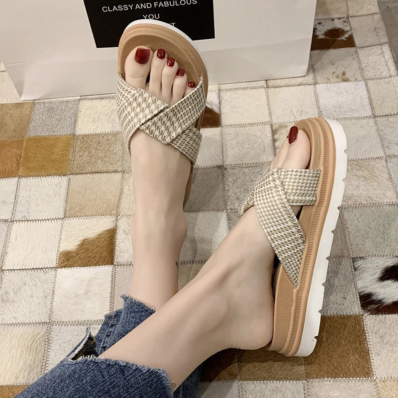 Comfortable and stylish herringbone slippers with a charming bow detail, perfect for indoor and light outdoor use.