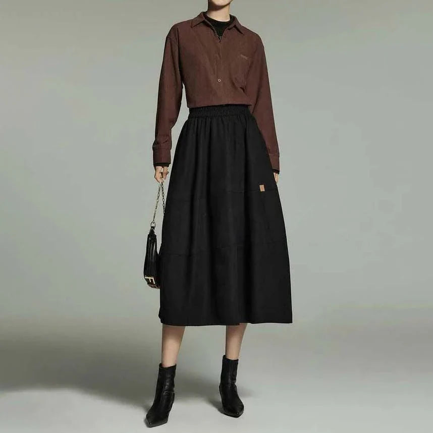A stylish and sophisticated mid-length A-line pleated skirt with pockets, crafted from high-quality twill fabric for durability and comfort.