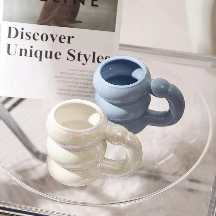 Charming ceramic coffee mug with a circular bubble design in a light blue colour, perfect for morning beverages in the UK