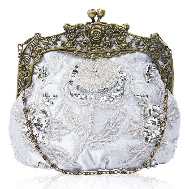A black cosmetic bag with exquisite bead embroidery, featuring a silk surface and nylon fabric texture for a luxurious feel.