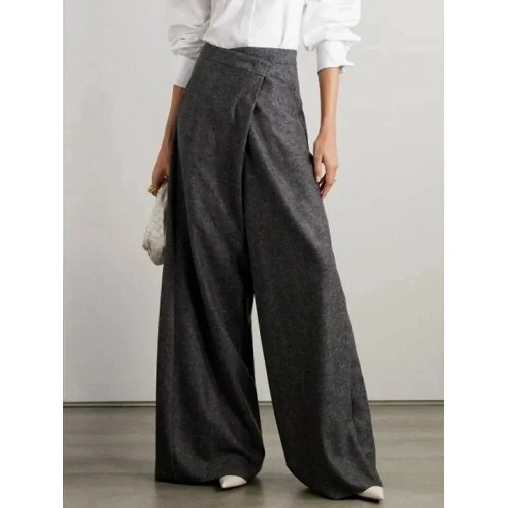 Elegant woollen wide-leg trousers in a high-waist design with unique asymmetric detailing, perfect for the discerning British woman.