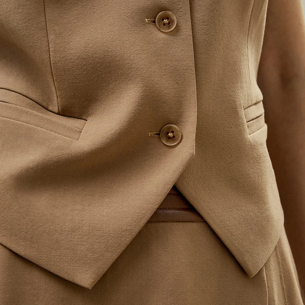 A refined silk-wool blend sleeveless vest with a smart collared V-neckline and single-breasted closure, offering versatile style and comfort.