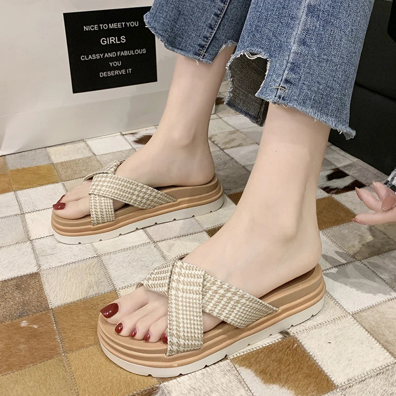 Comfortable and stylish herringbone slippers with a charming bow detail, perfect for indoor and light outdoor use.