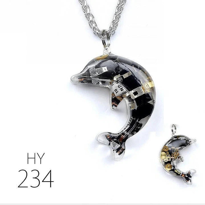 Steampunk-inspired dolphin pendant necklace with electronic components and brass accents