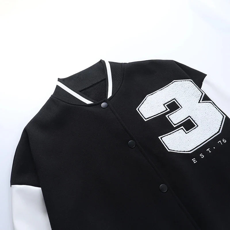 A classic British-style baseball jacket with contrast PU stitching, showcasing a sophisticated and versatile design for casual wear.